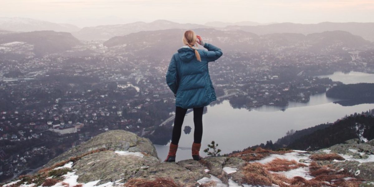 Girl-Looking-at-town-winter