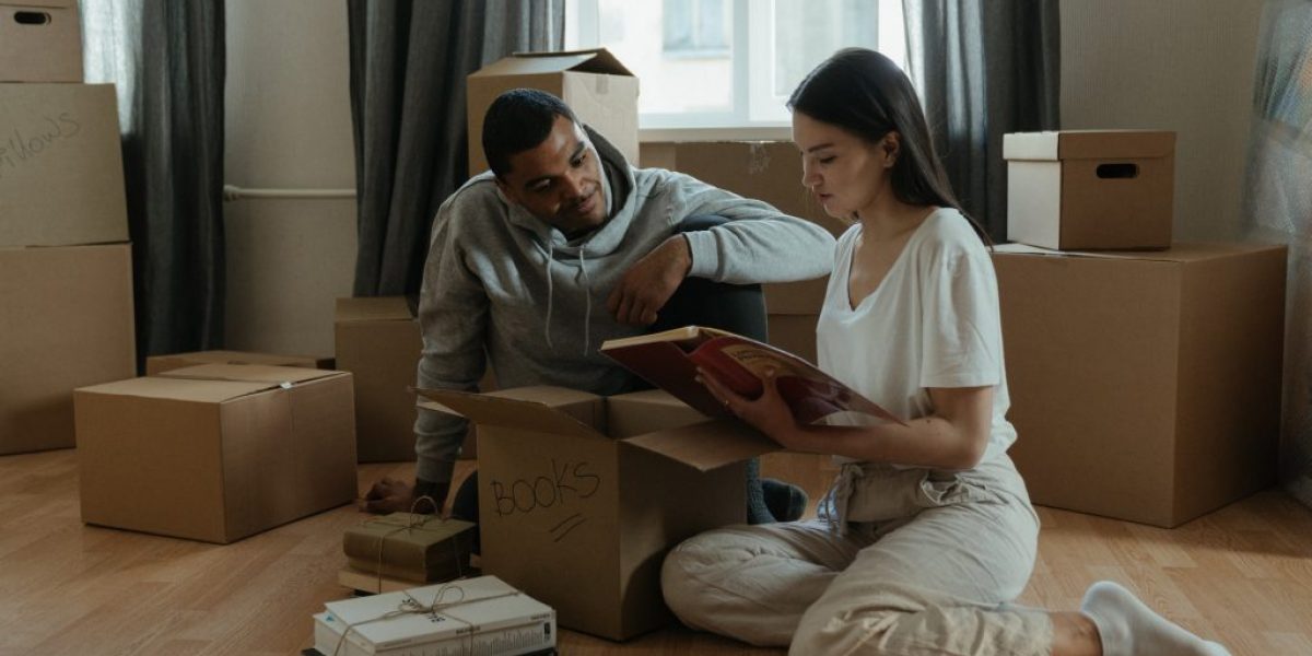 man-and-woman-sitting-on-brown-wooden-table-4554383