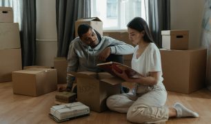 man-and-woman-sitting-on-brown-wooden-table-4554383